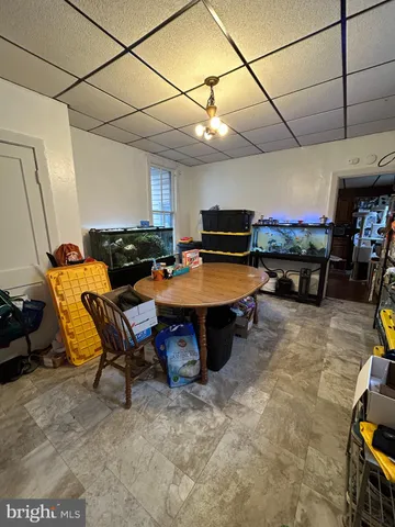 a room with furniture and a flat screen tv