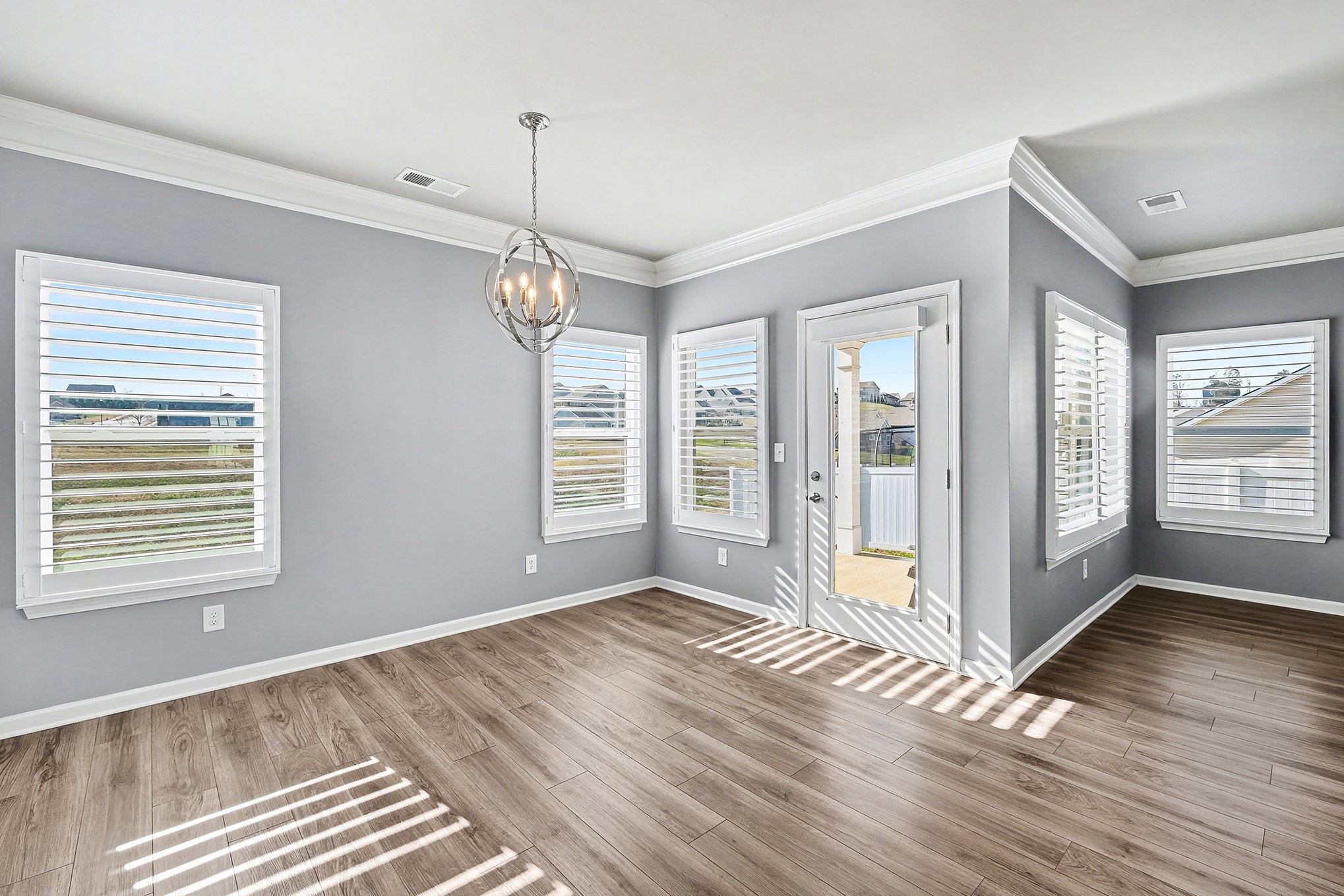 2932 Timewinder Way Columbia, TN 38401 - Photo 11 of 37 a view of an empty room with wooden floor and a window