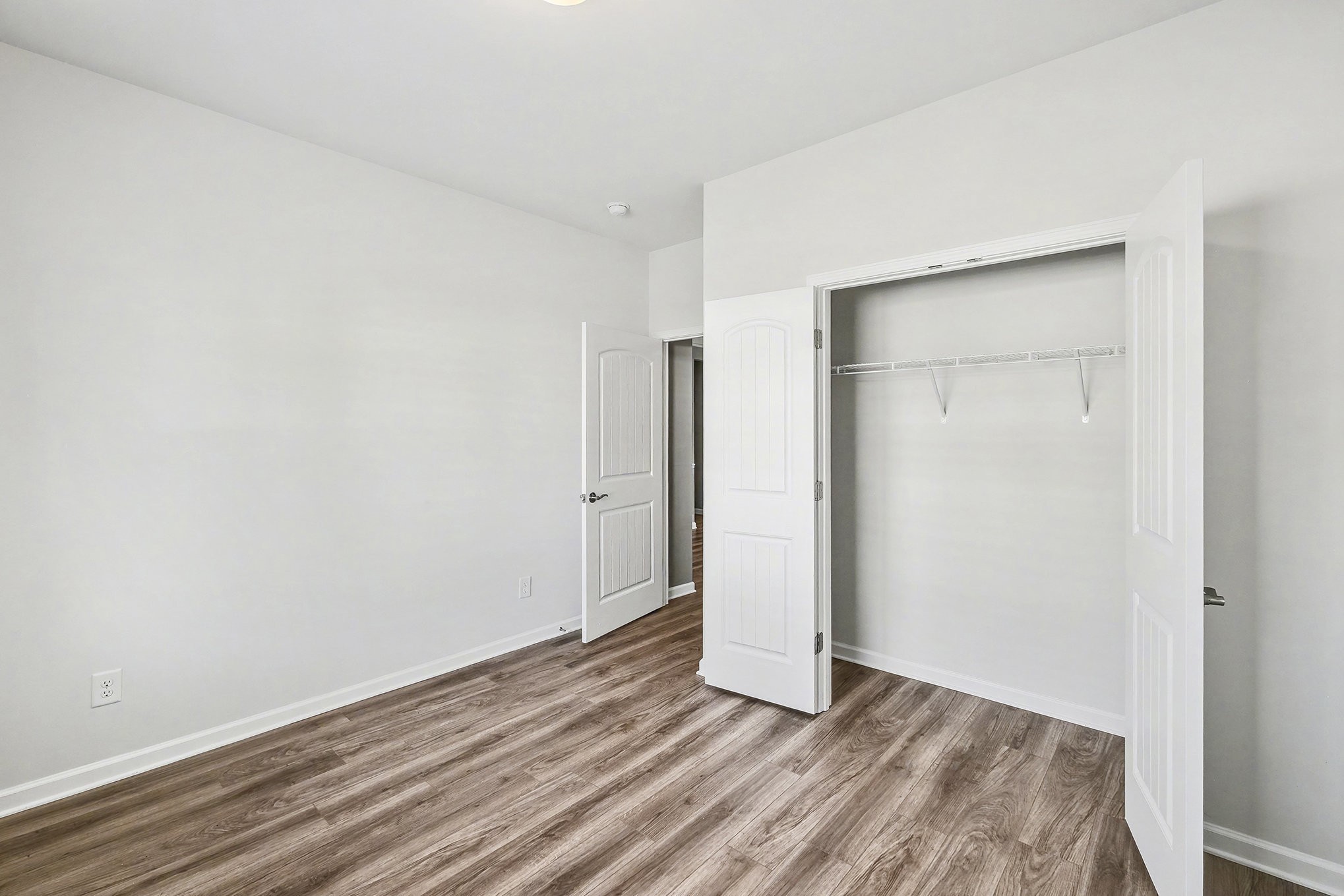 2932 Timewinder Way Columbia, TN 38401 - Photo 27 of 37 an empty room with wooden floor and closet