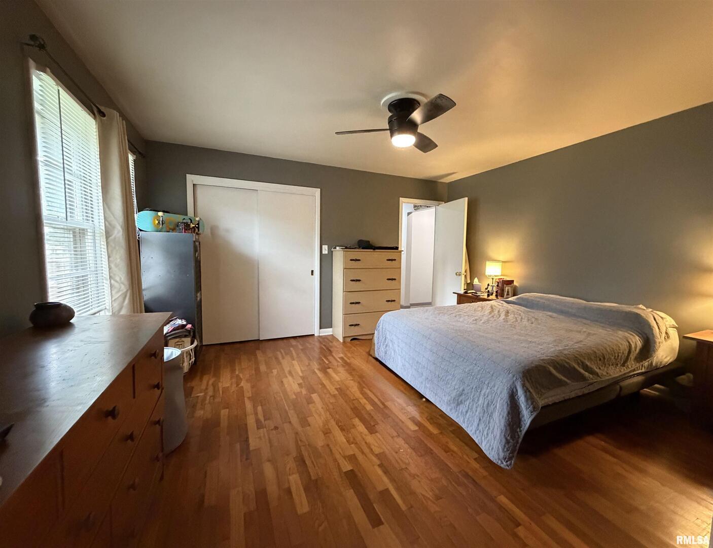117 Marshall Place Carmi, IL 62821 - Photo 12 of 25 a spacious bedroom with a bed and a flat screen tv