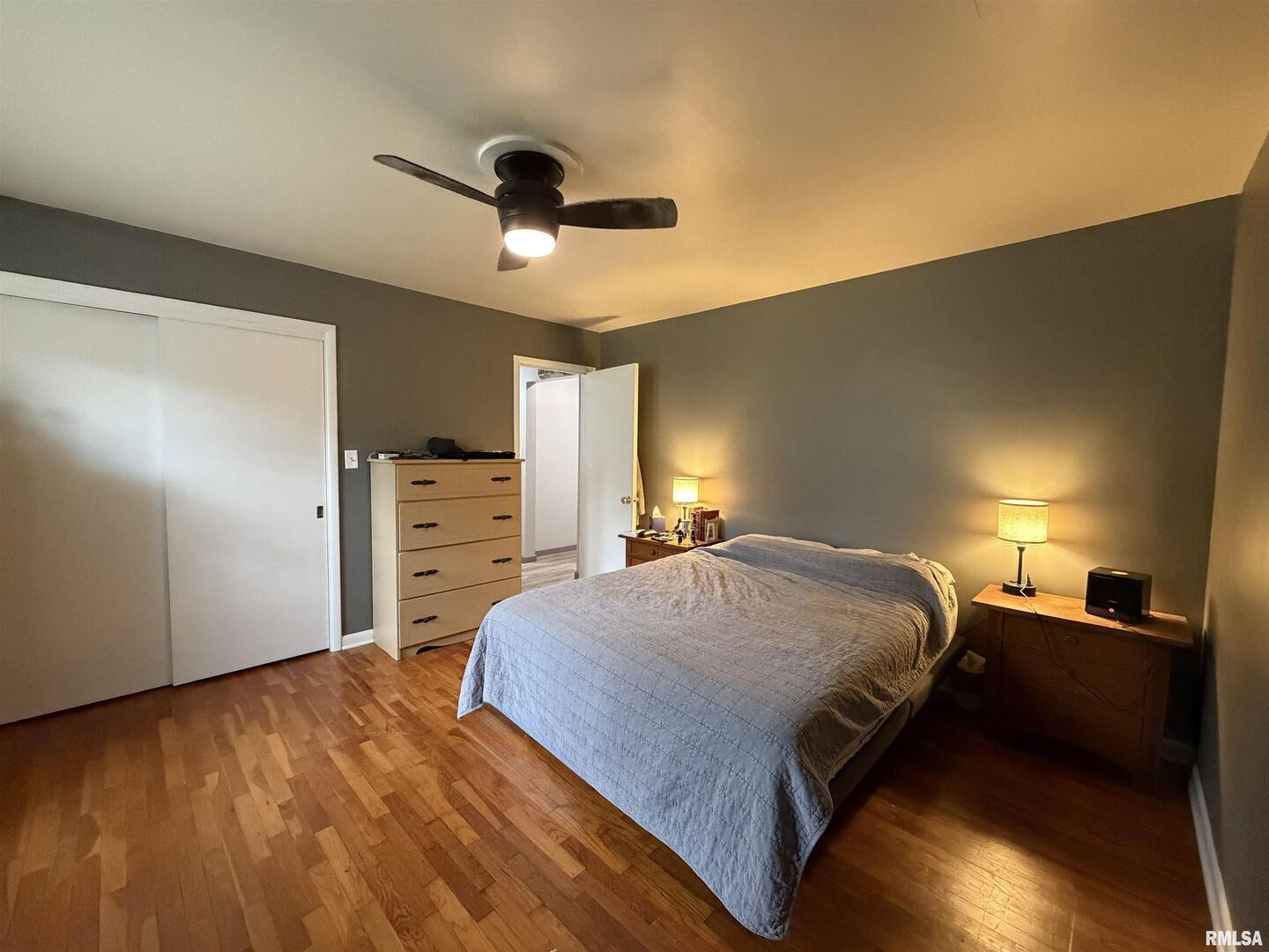 117 Marshall Place Carmi, IL 62821 - Photo 13 of 25 a spacious bedroom with a bed and a ceiling fan