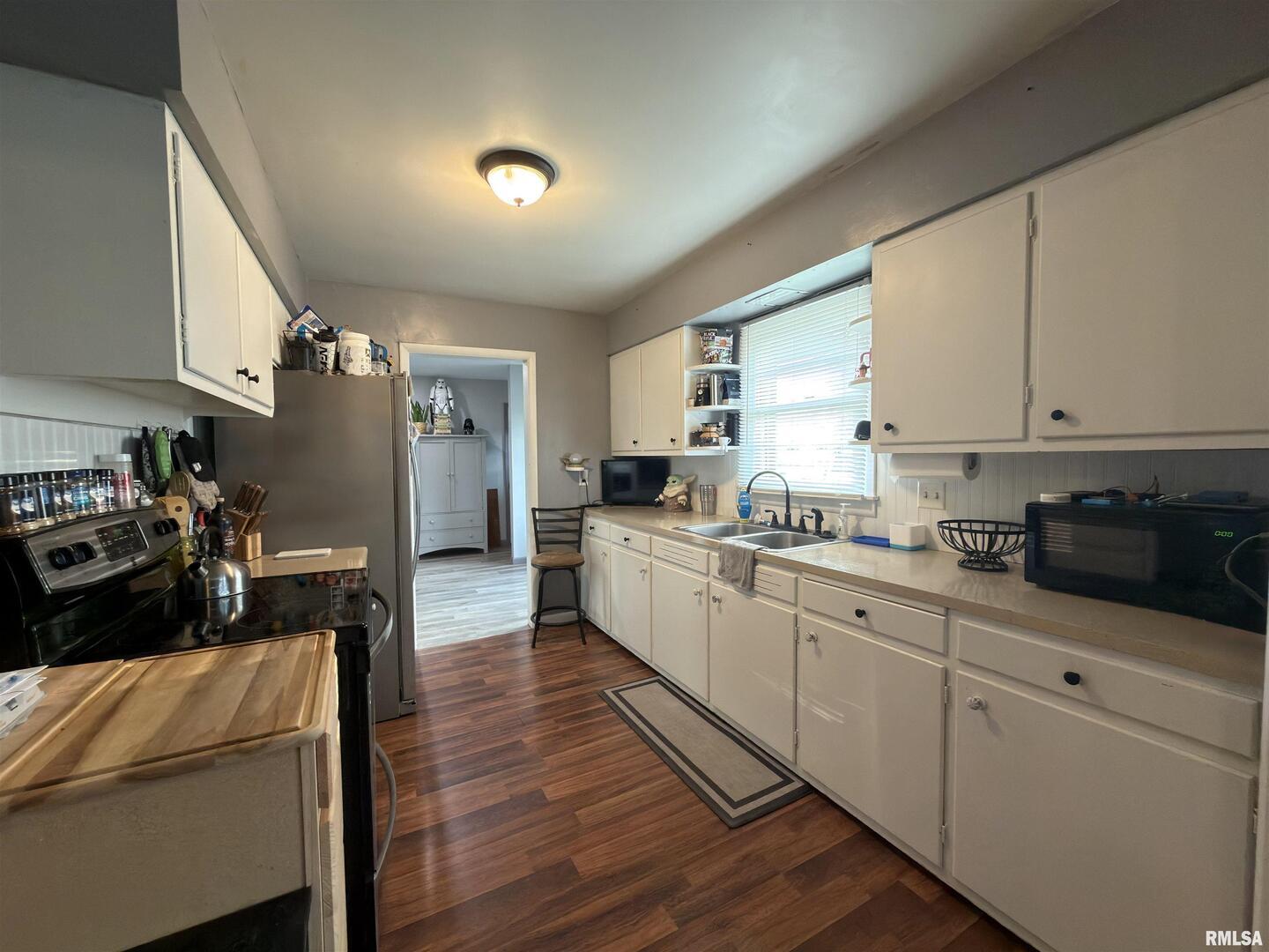 117 Marshall Place Carmi, IL 62821 - Photo 8 of 25 a kitchen with refrigerator and cabinets