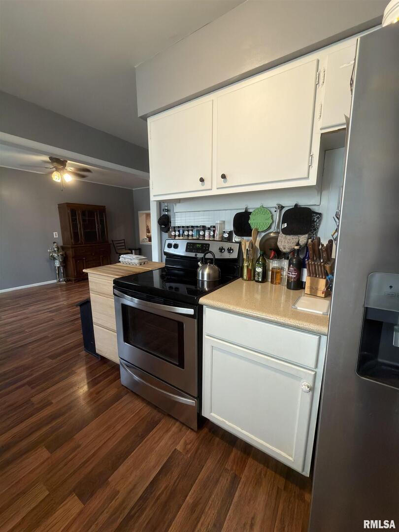 117 Marshall Place Carmi, IL 62821 - Photo 9 of 25 a kitchen with stainless steel appliances a stove a sink and a refrigerator