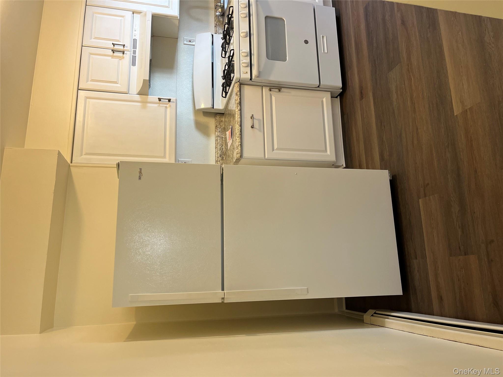 21 Vernon Terrace, Unit 1 Poughkeepsie, NY 12601 - Photo 13 of 23 a white refrigerator freezer sitting in a kitchen