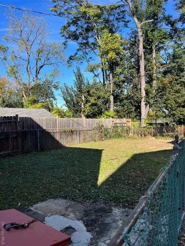 a view of a backyard of the house