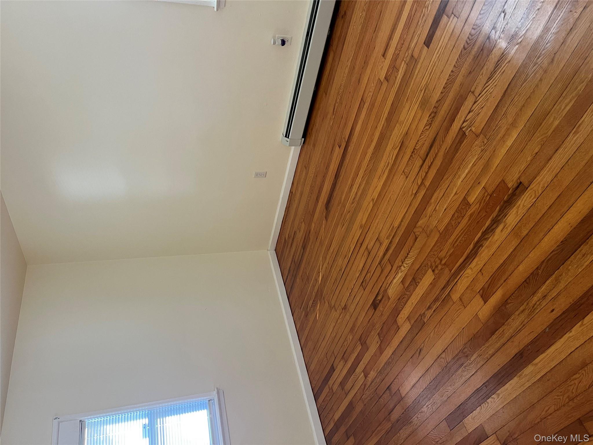 21 Vernon Terrace, Unit 1 Poughkeepsie, NY 12601 - Photo 19 of 23 a view of empty room with wooden floor and fan