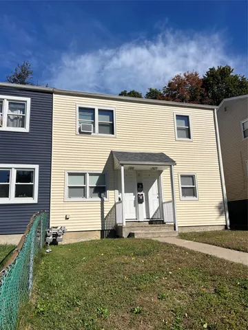 a view of a back yard of the house