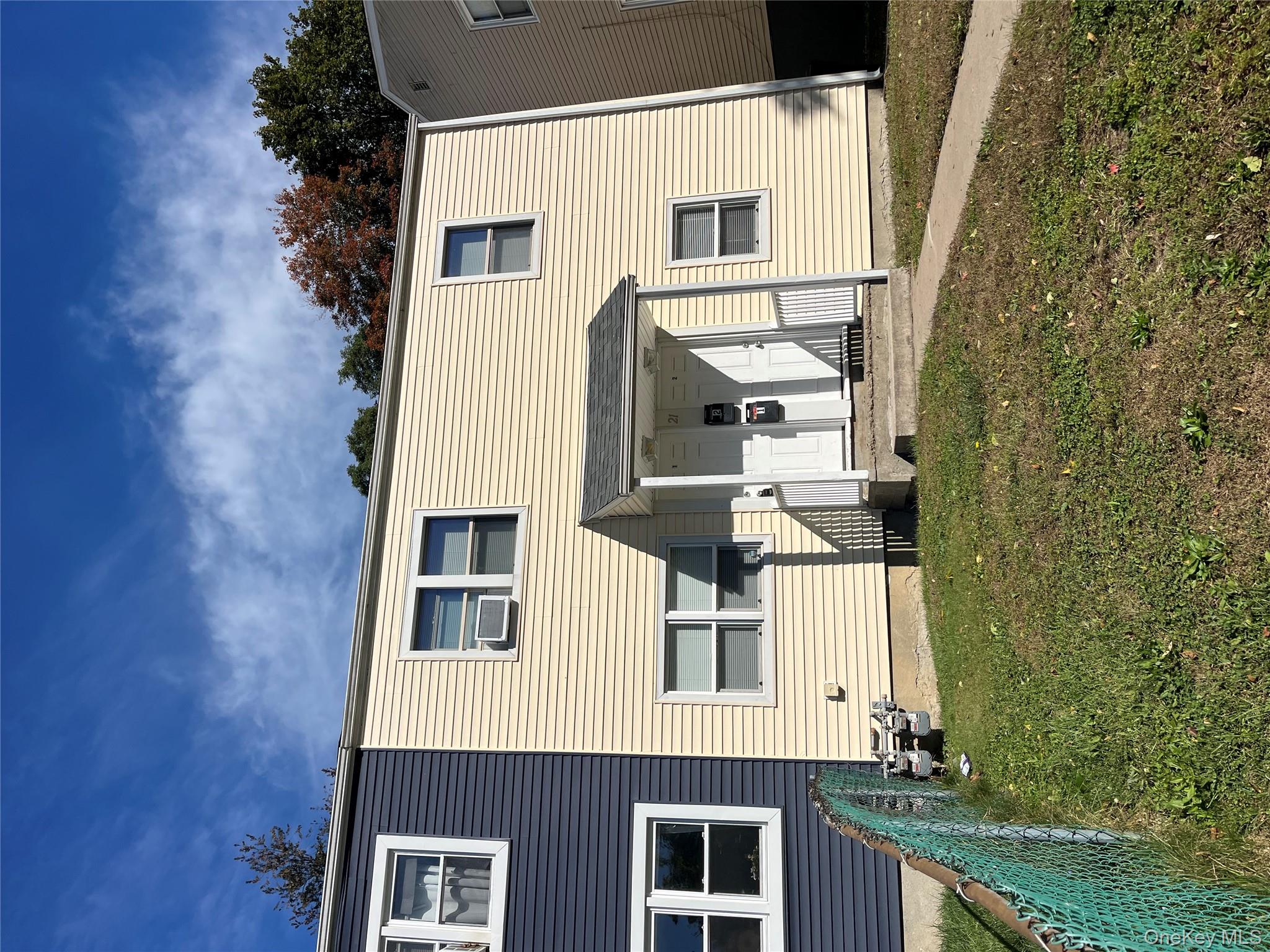 21 Vernon Terrace, Unit 1 Poughkeepsie, NY 12601 - Photo 2 of 23 a view of a back yard of the house
