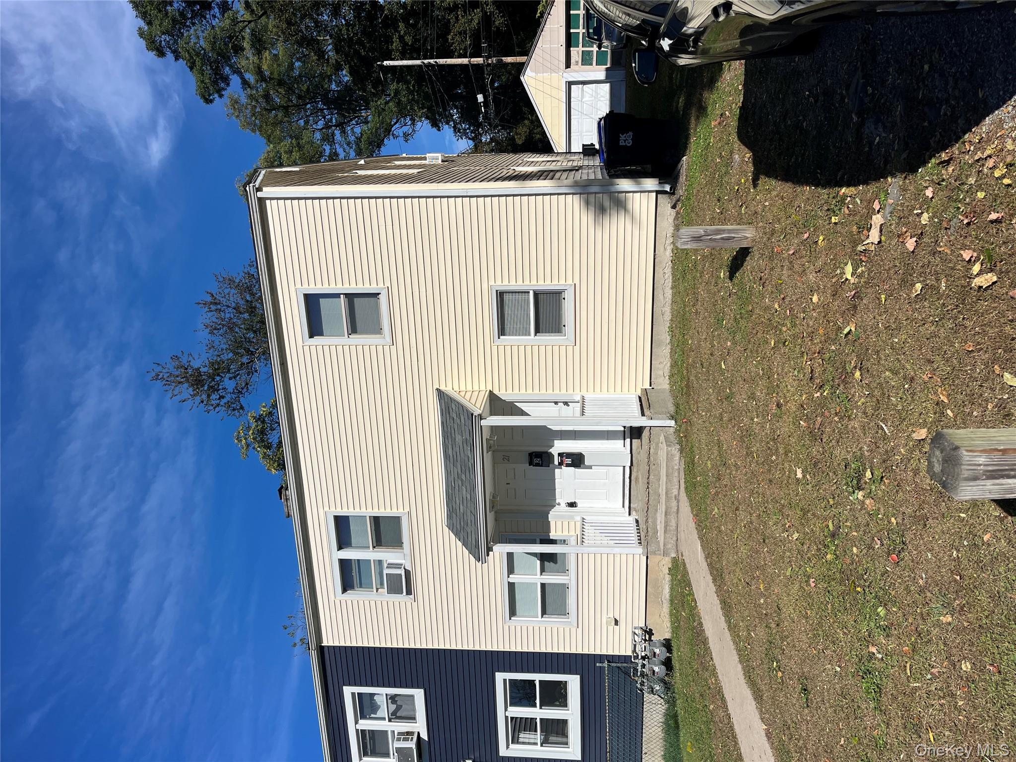21 Vernon Terrace, Unit 1 Poughkeepsie, NY 12601 - Photo 3 of 23 a backyard of a house with yard fire pit and outdoor seating