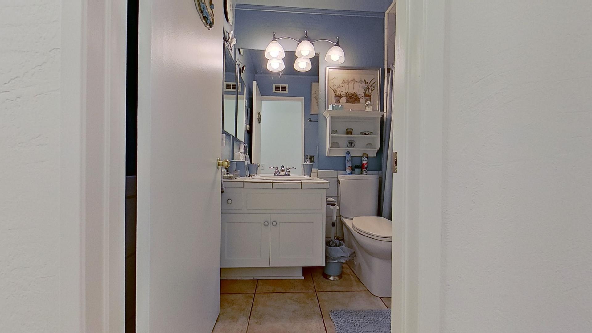 615 Eston Place Lancaster, CA 93535 - Photo 17 of 46 a bathroom with a sink and a mirror