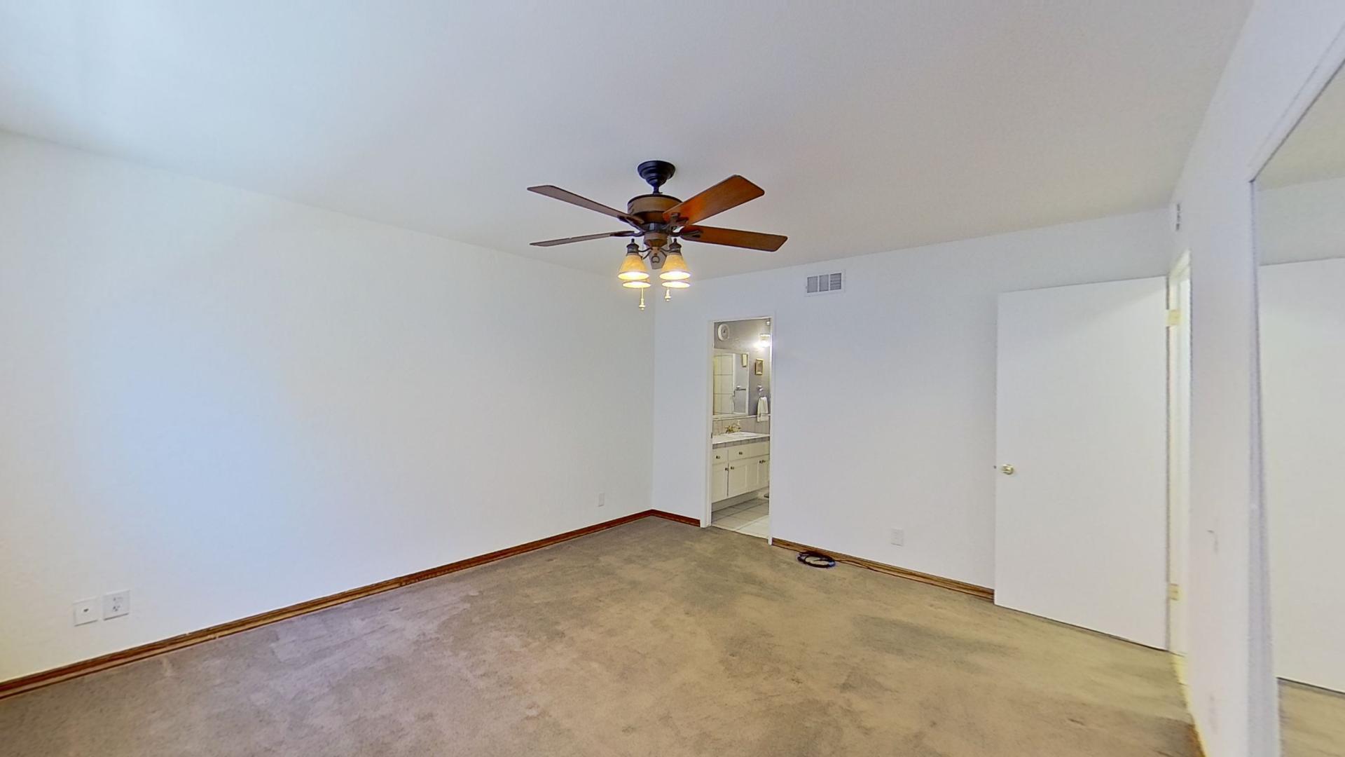 615 Eston Place Lancaster, CA 93535 - Photo 20 of 46 a view of an empty room with a ceiling fan