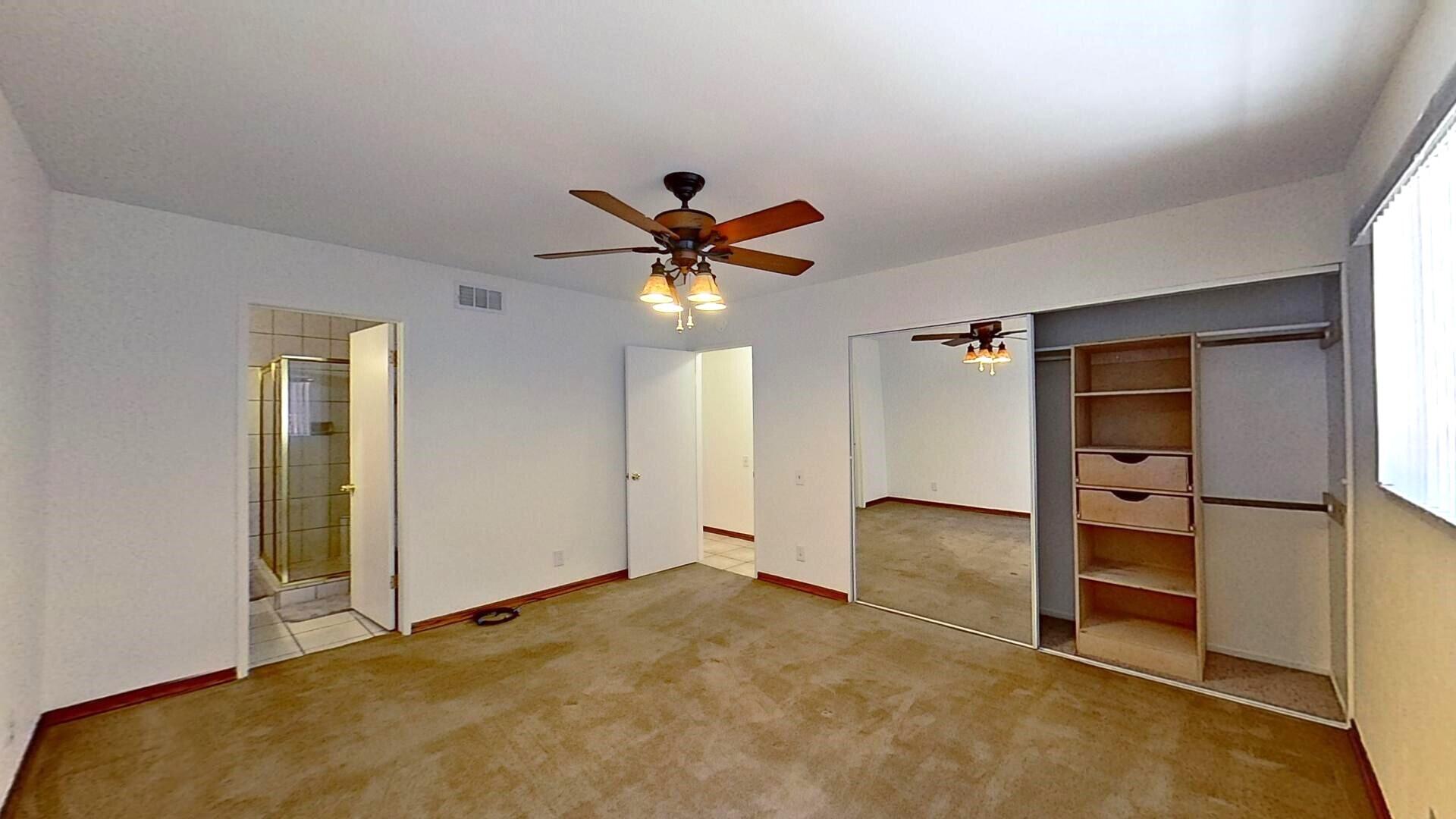 615 Eston Place Lancaster, CA 93535 - Photo 21 of 46 a view of an empty room with a ceiling fan