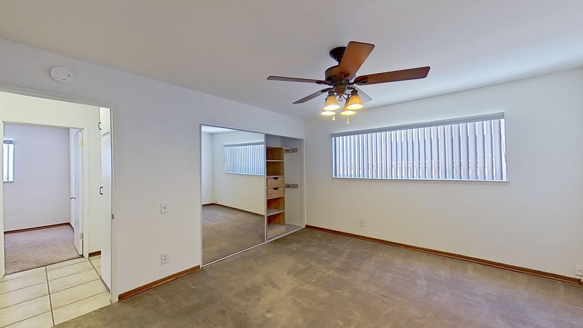 615 Eston Place Lancaster, CA 93535 - Photo 22 of 46 a view of a livingroom with a ceiling fan and window