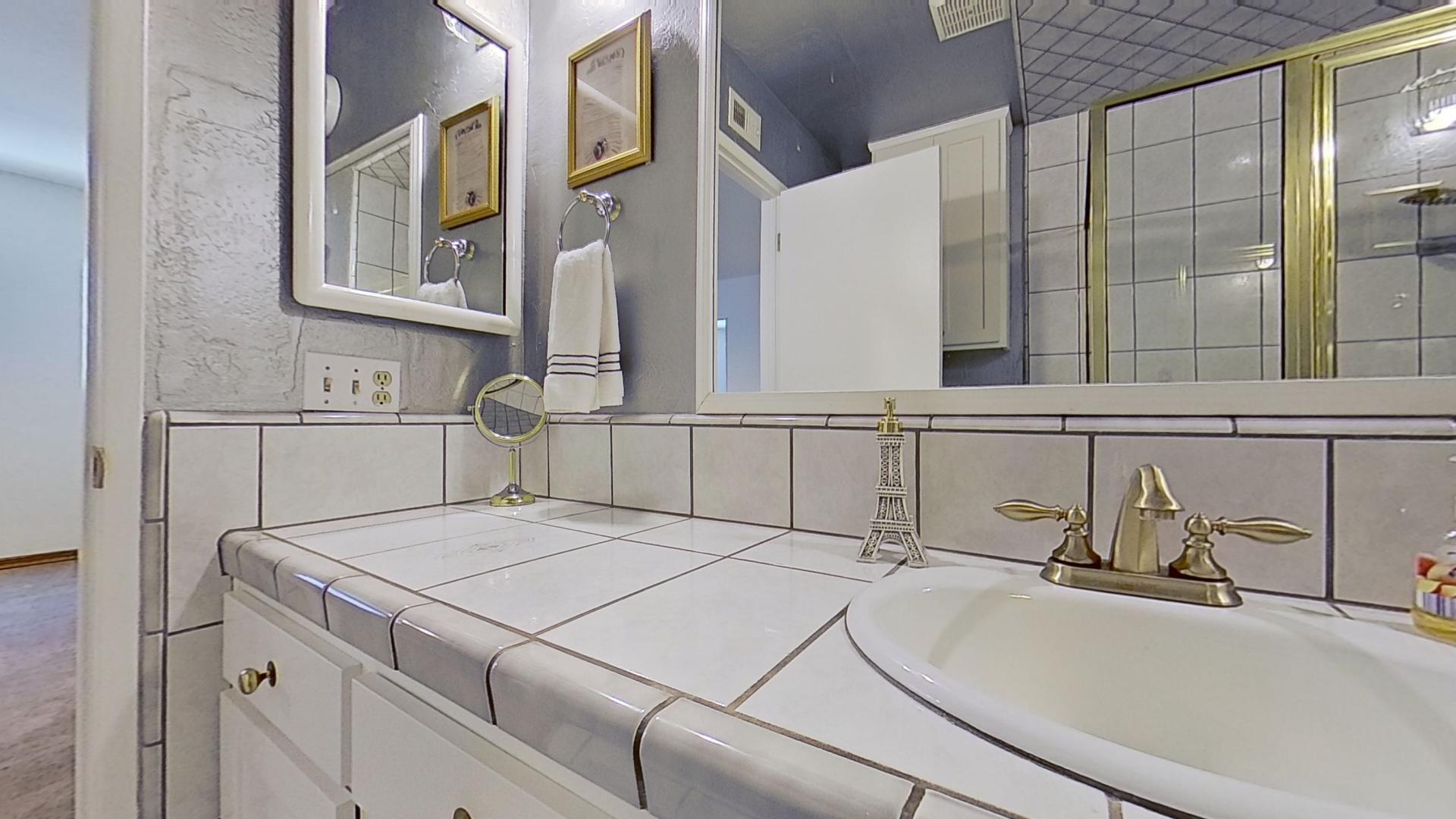 615 Eston Place Lancaster, CA 93535 - Photo 24 of 46 a bathroom with a sink and mirror