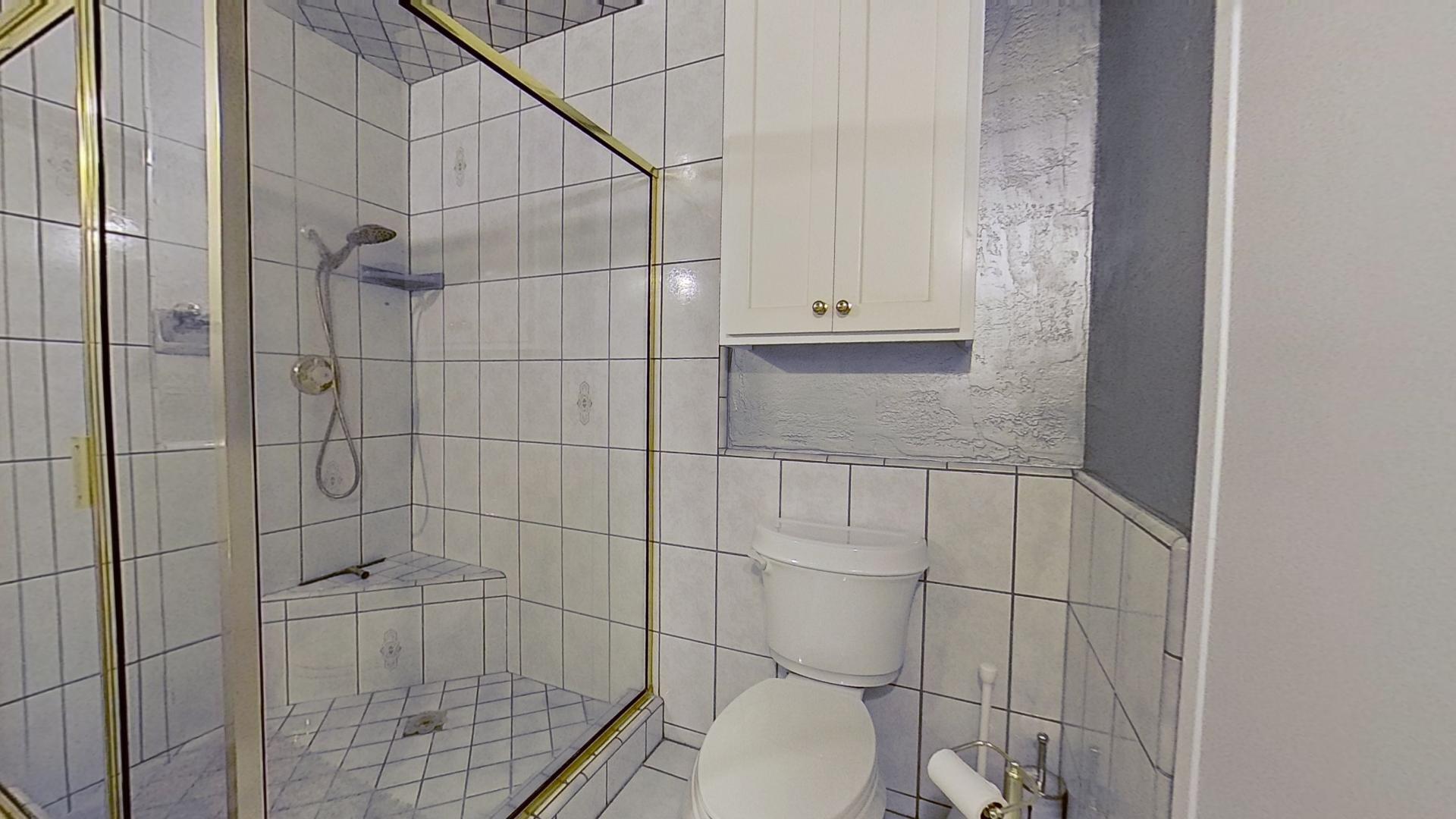 615 Eston Place Lancaster, CA 93535 - Photo 26 of 46 a bathroom with a toilet and shower