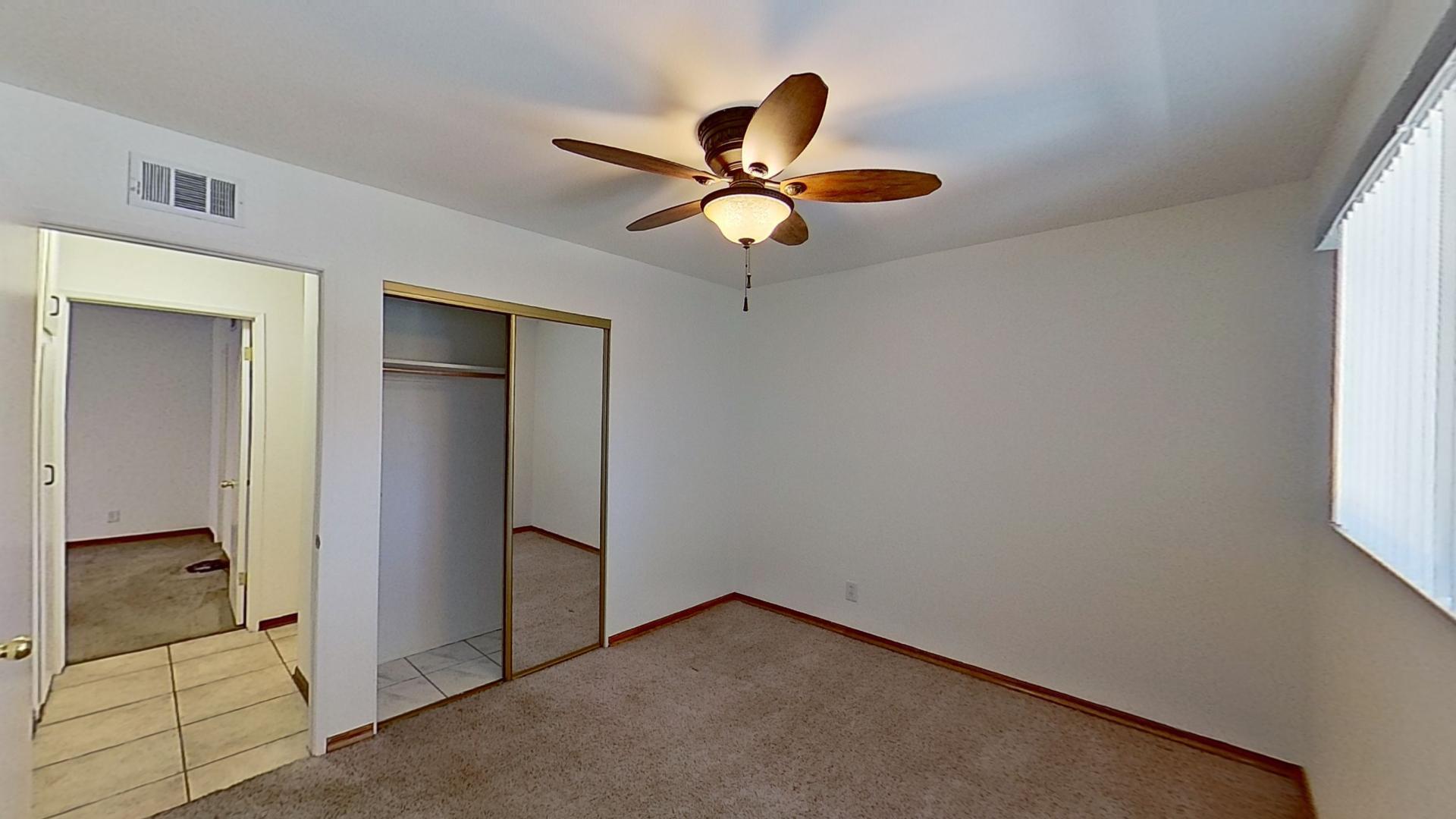 615 Eston Place Lancaster, CA 93535 - Photo 30 of 46 a view of a livingroom with a chandelier fan and closet