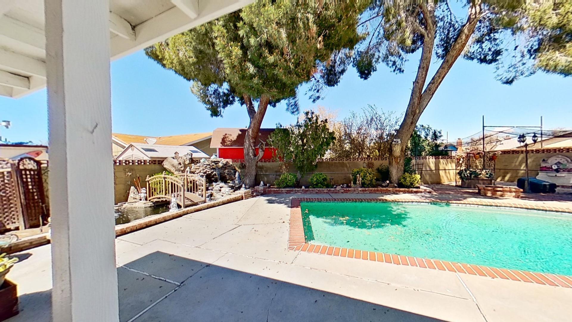 615 Eston Place Lancaster, CA 93535 - Photo 35 of 46 a view of a park with potted plants and large trees
