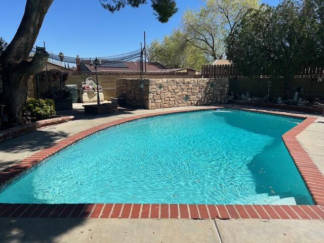 615 Eston Place Lancaster, CA 93535 - Photo 4 of 46 a view of a backyard with sitting area