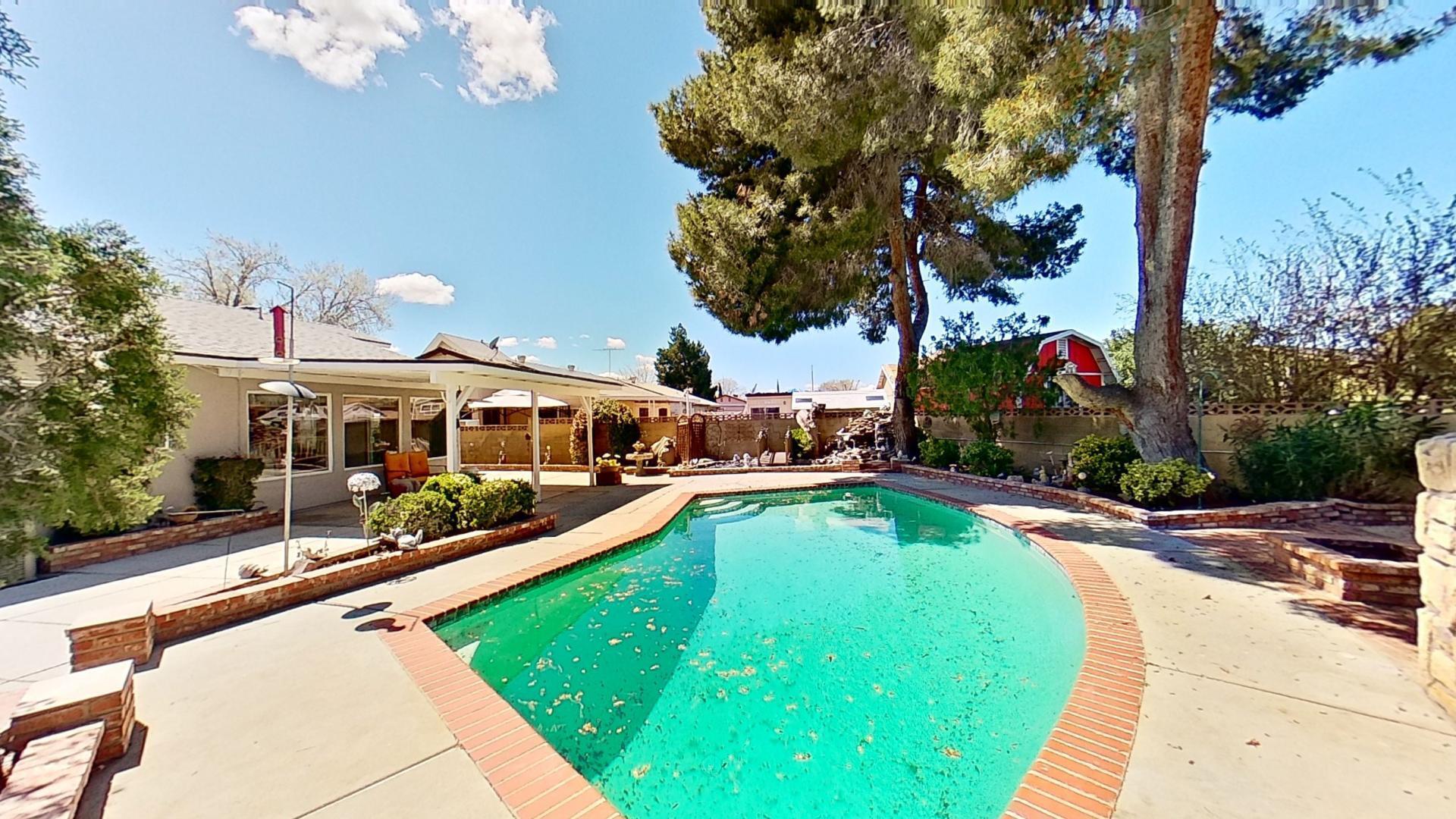 615 Eston Place Lancaster, CA 93535 - Photo 41 of 46 a view of a swimming pool with a patio and a yard