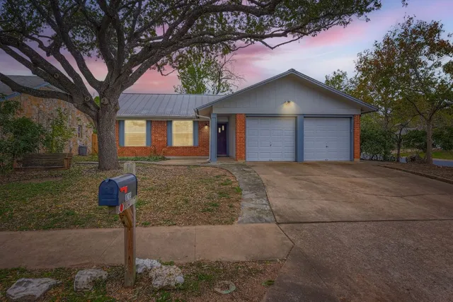 a front view of a house with yard