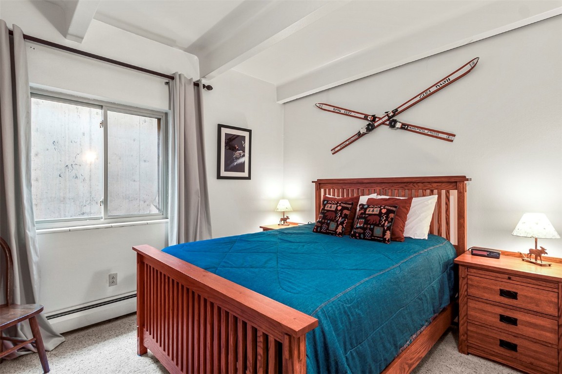 370 La Bonte Street, Unit F Dillon, CO 80435 - Photo 11 of 30 a bedroom with a bed and a window