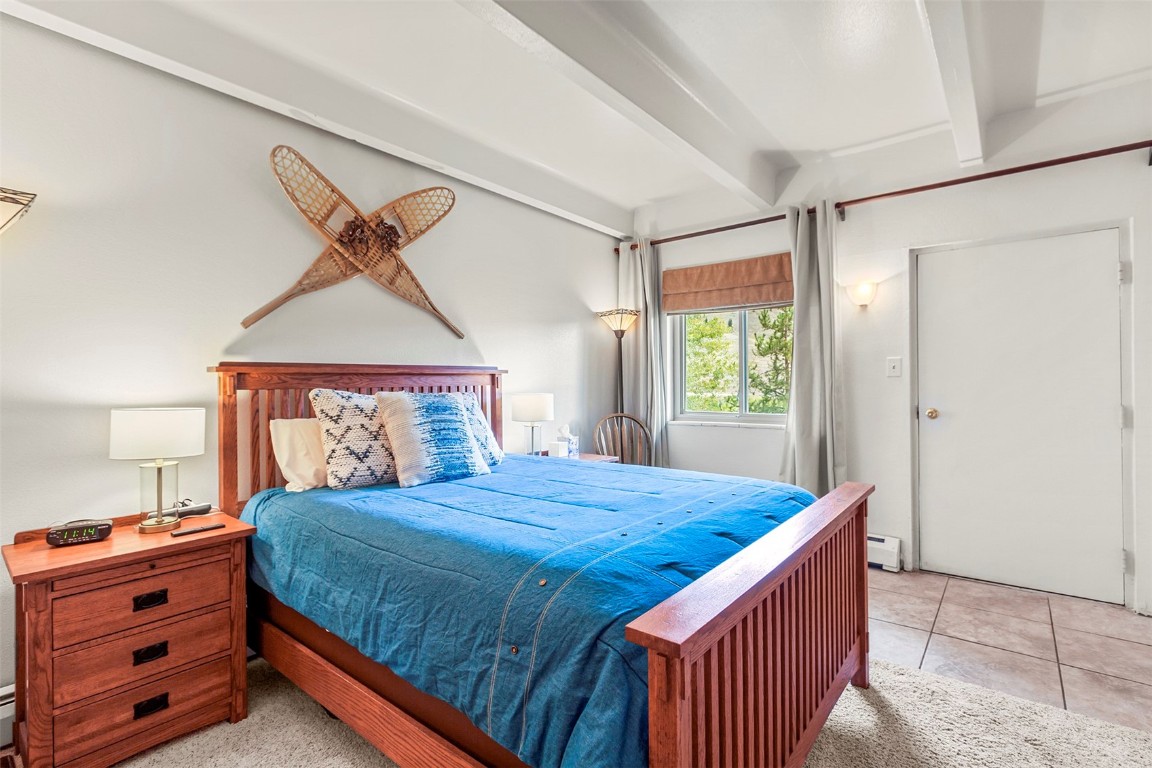 370 La Bonte Street, Unit F Dillon, CO 80435 - Photo 14 of 30 a bedroom with a bed and window