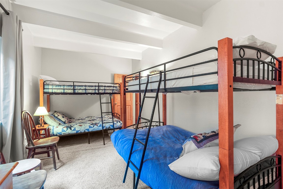 370 La Bonte Street, Unit F Dillon, CO 80435 - Photo 16 of 30 a bedroom with furniture and a air conditioner vent