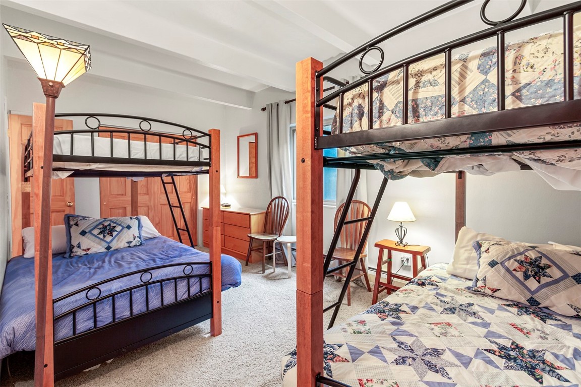 370 La Bonte Street, Unit F Dillon, CO 80435 - Photo 17 of 30 a bedroom with a bed and a window