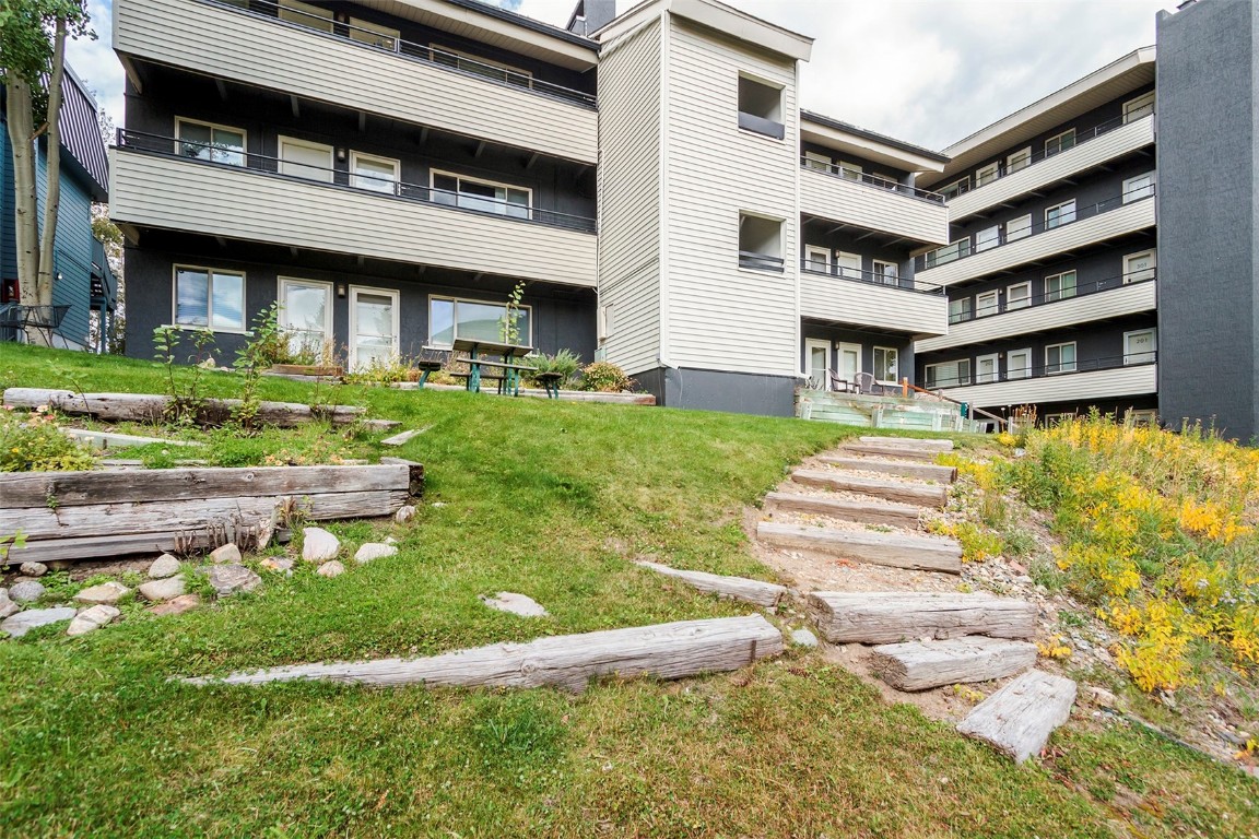 370 La Bonte Street, Unit F Dillon, CO 80435 - Photo 25 of 30 a front view of a house with a yard table and chairs