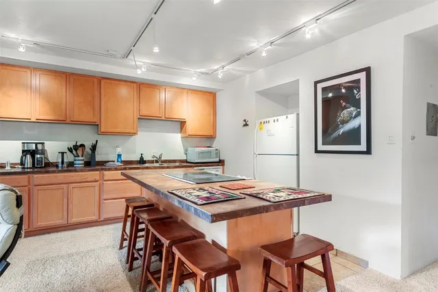 a kitchen with a dining table and chairs