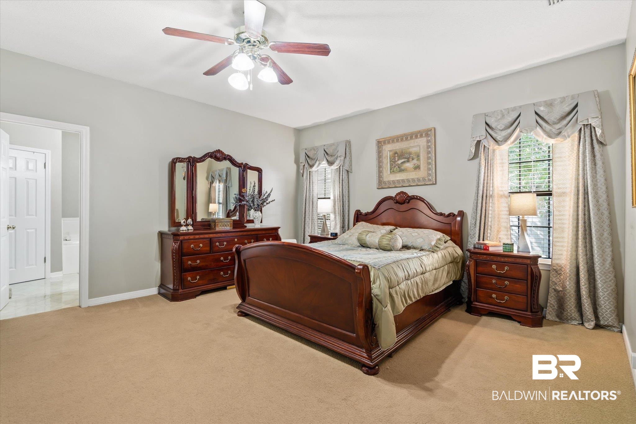 7360 Bridgewood Court Mobile, AL 36695 - Photo 13 of 30 Carpeted bedroom with connected bathroom and ceiling fan