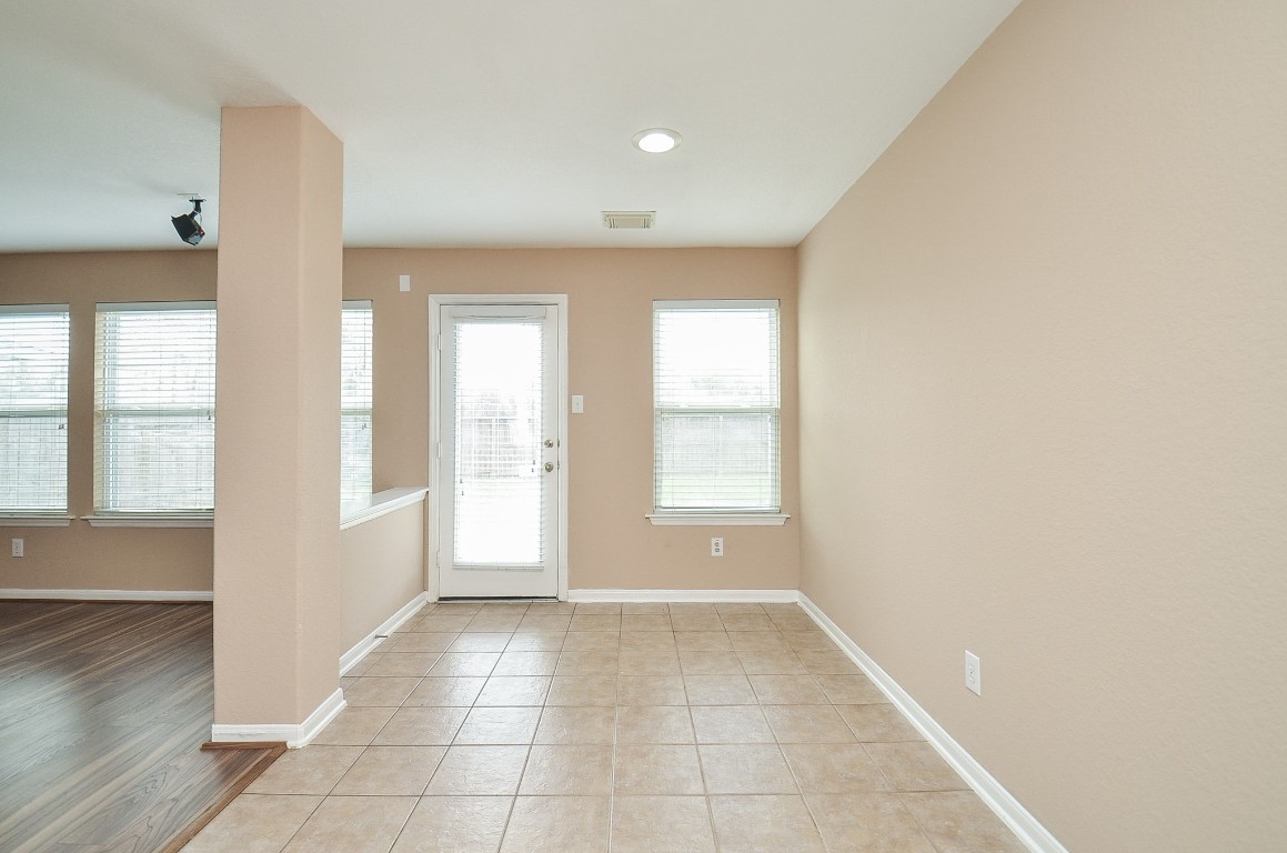 7134 Winston Ranch Parkway Richmond, TX 77406 - Photo 11 of 32 a view of an empty room with a window
