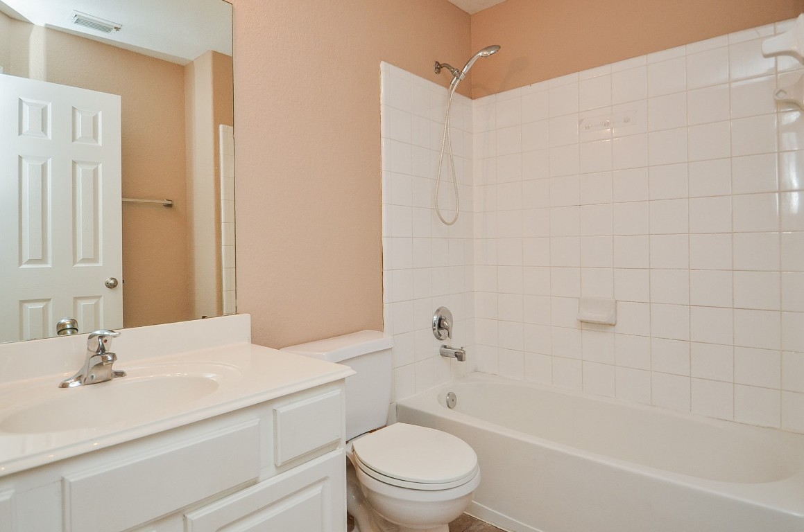 7134 Winston Ranch Parkway Richmond, TX 77406 - Photo 27 of 32 a bathroom with a sink a toilet and shower
