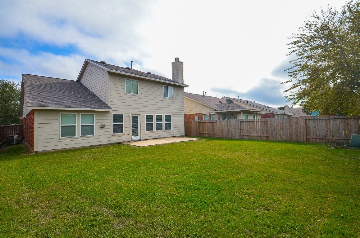 7134 Winston Ranch Parkway Richmond, TX 77406 - Photo 30 of 32 a view of a house with backyard