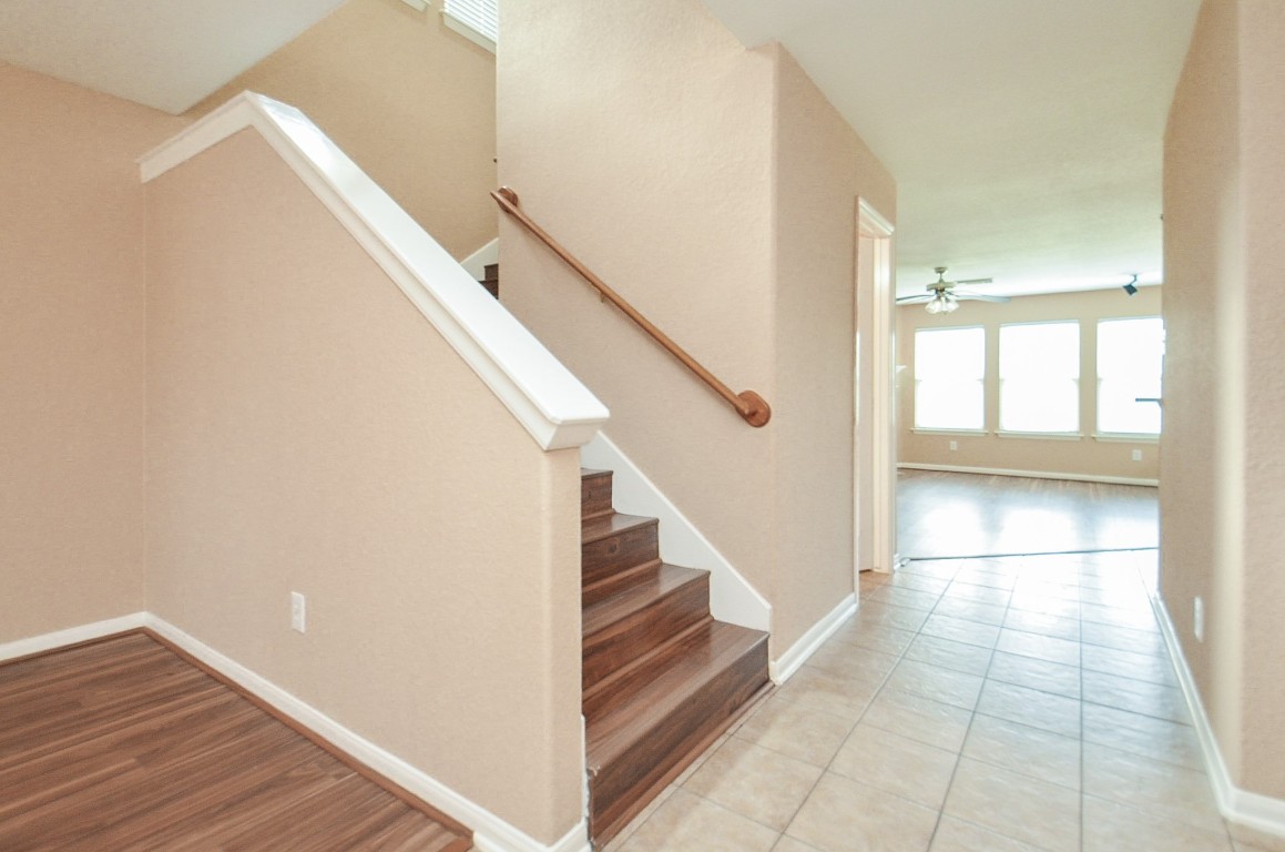 7134 Winston Ranch Parkway Richmond, TX 77406 - Photo 8 of 32 a view of entryway and kitchen with wooden floor