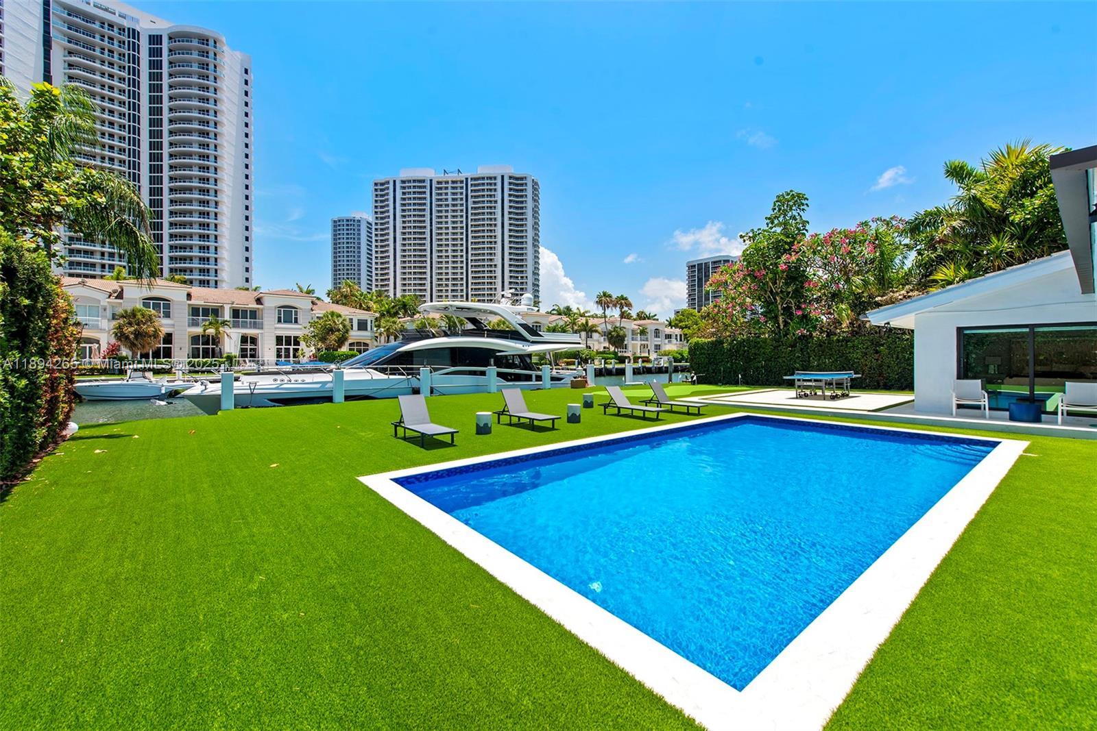 207 Holiday Drive Hallandale Beach, FL 33009 - Photo 13 of 50 a view of a house with swimming pool