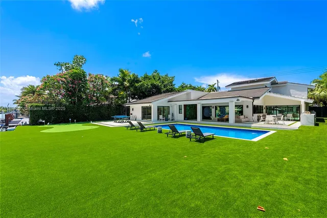 a view of an chairs and table in a patio