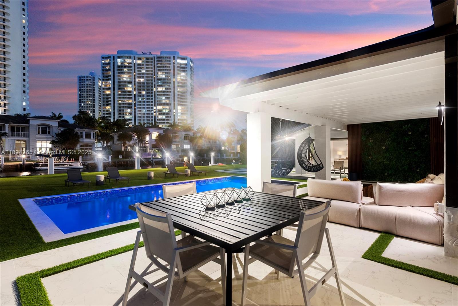 207 Holiday Drive Hallandale Beach, FL 33009 - Photo 17 of 50 a view of an chairs and tables in the patio