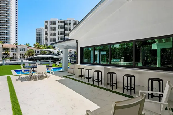 a view of swimming pool with chairs