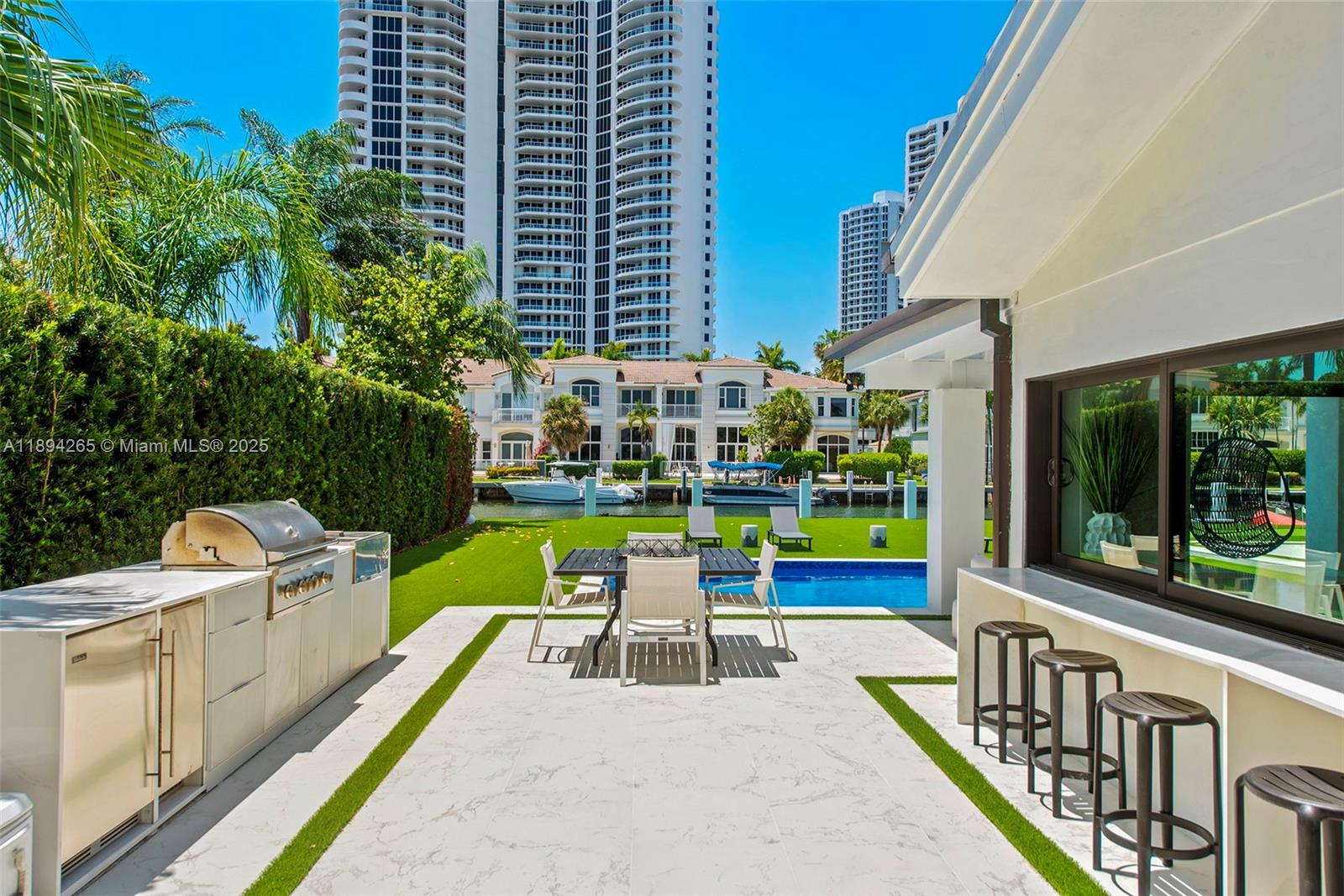 207 Holiday Drive Hallandale Beach, FL 33009 - Photo 19 of 50 a view of swimming pool with chairs