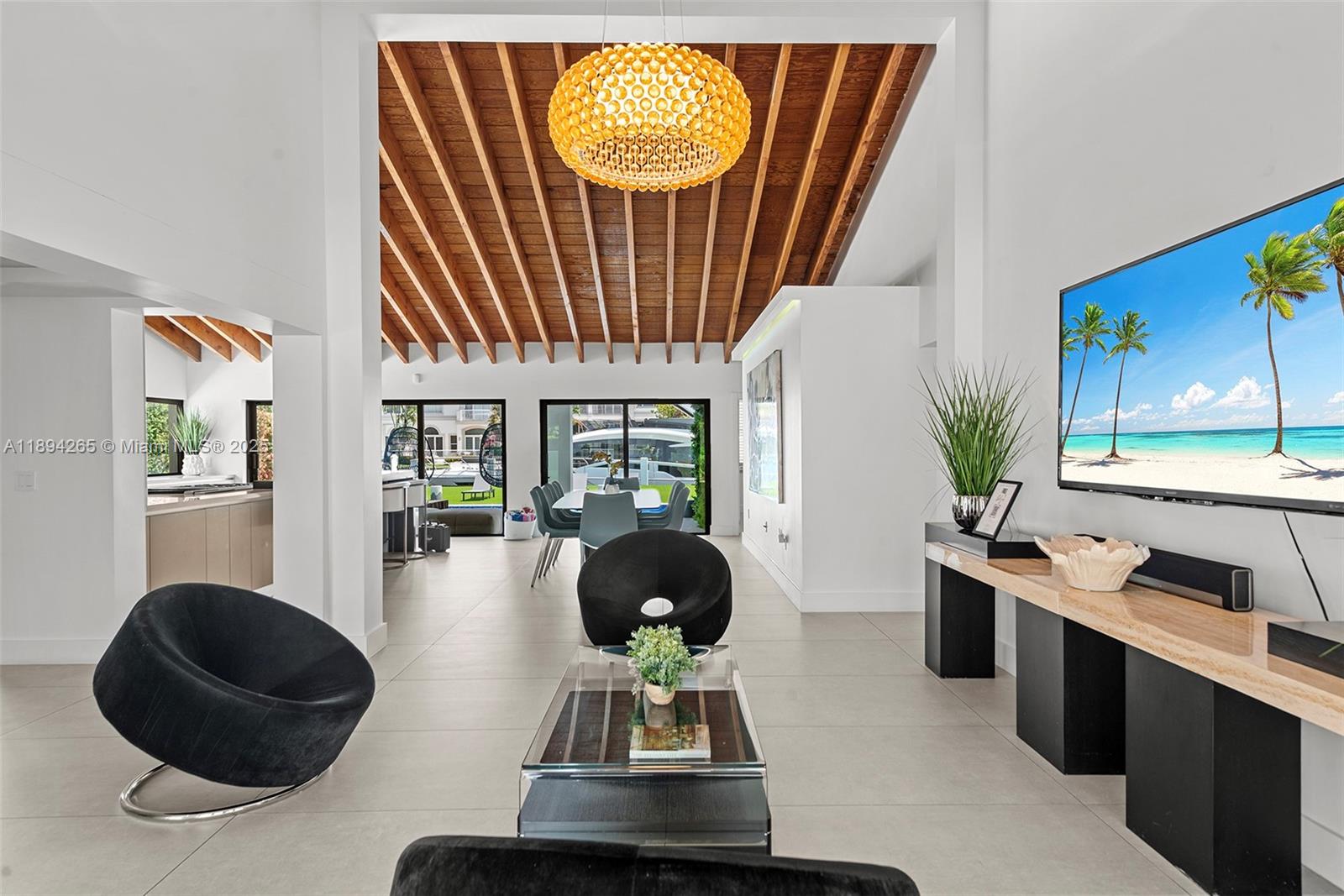 207 Holiday Drive Hallandale Beach, FL 33009 - Photo 24 of 50 a living room with furniture and a potted plant