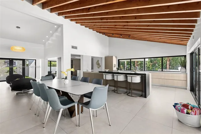 a kitchen with stainless steel appliances granite countertop a sink and a counter space