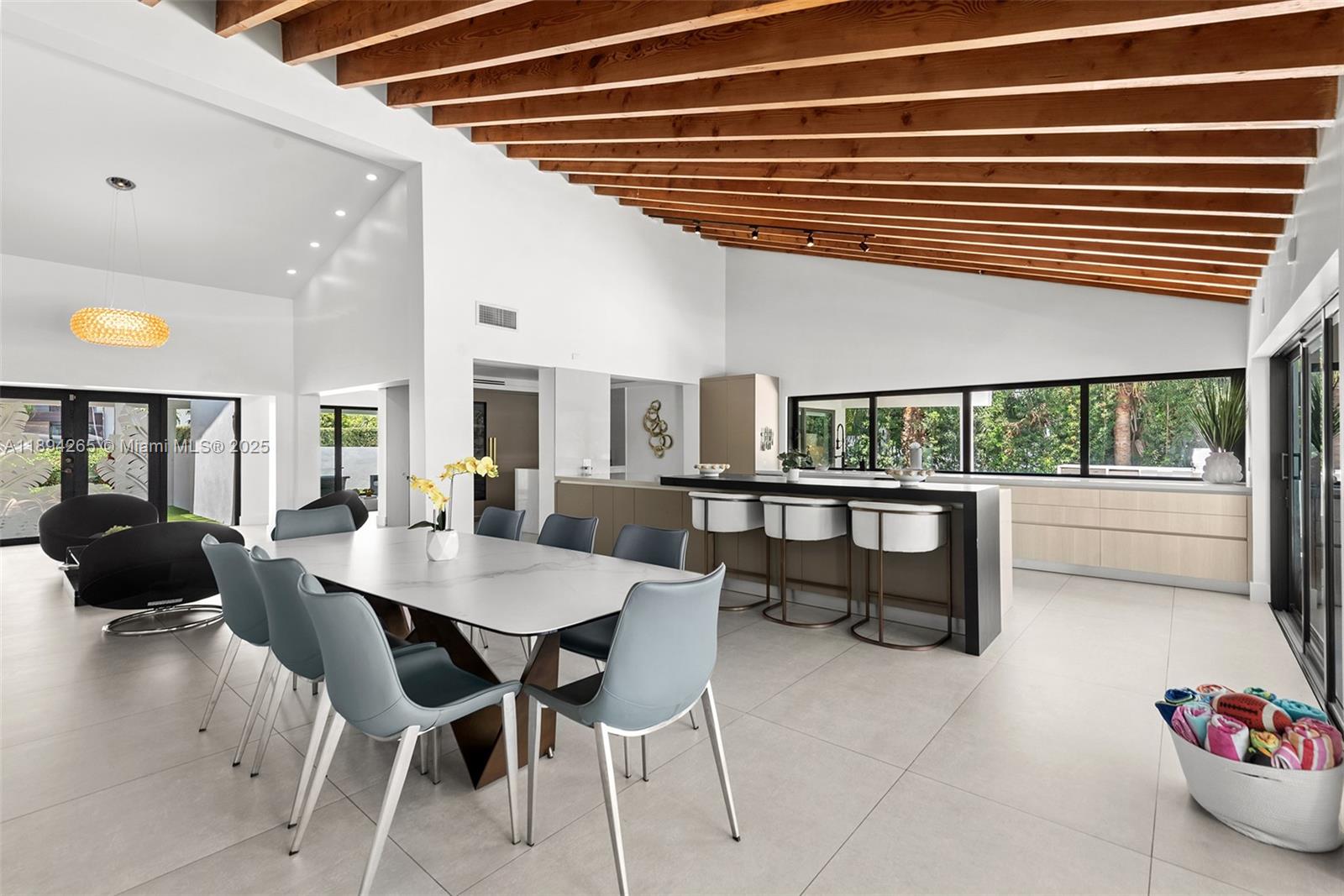 207 Holiday Drive Hallandale Beach, FL 33009 - Photo 27 of 50 a dining room with furniture and a large window