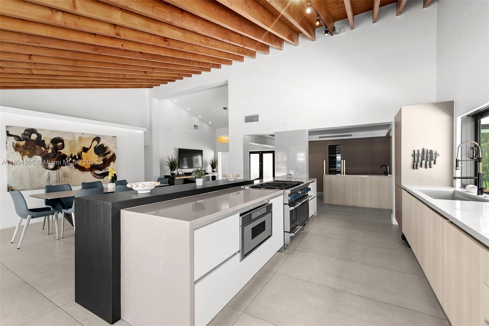 207 Holiday Drive Hallandale Beach, FL 33009 - Photo 29 of 50 a large white kitchen with lots of counter top space