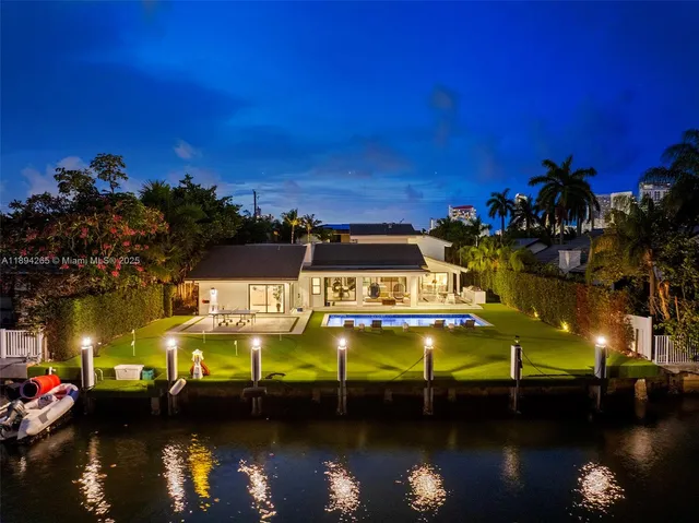 a view of swimming pool with a table and chairs