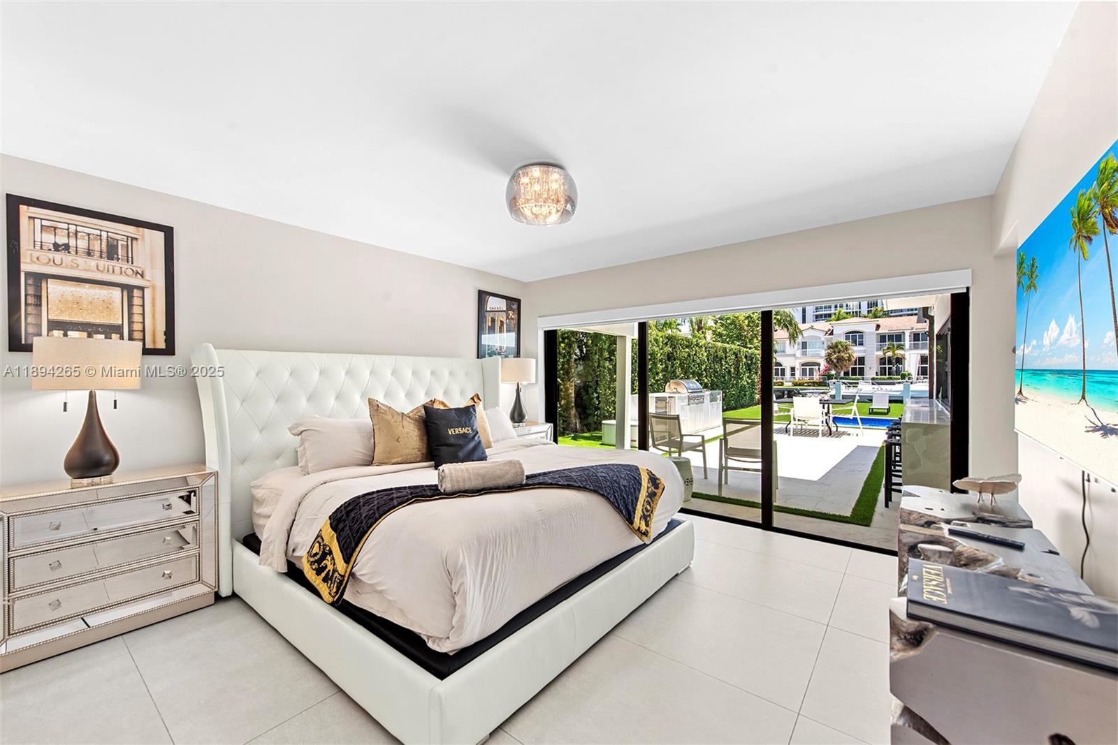 207 Holiday Drive Hallandale Beach, FL 33009 - Photo 35 of 50 a bedroom with a bed and a large window with balcony view