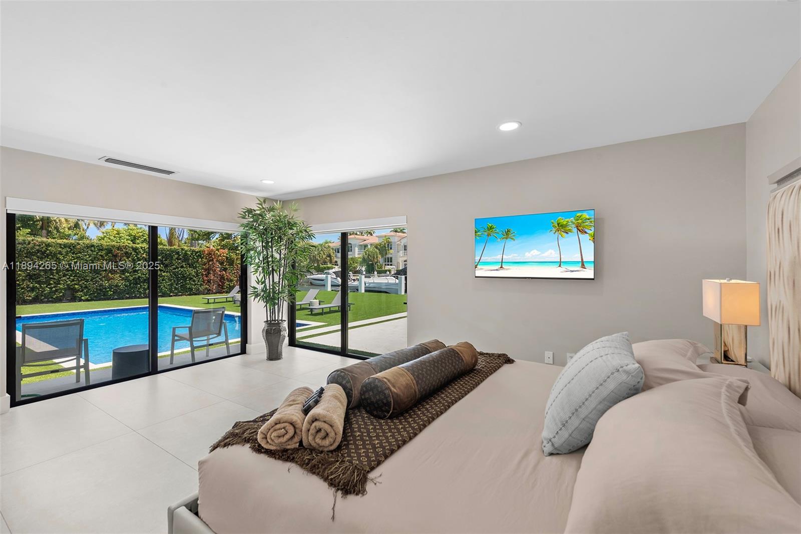 207 Holiday Drive Hallandale Beach, FL 33009 - Photo 36 of 50 a bedroom with furniture and a large window