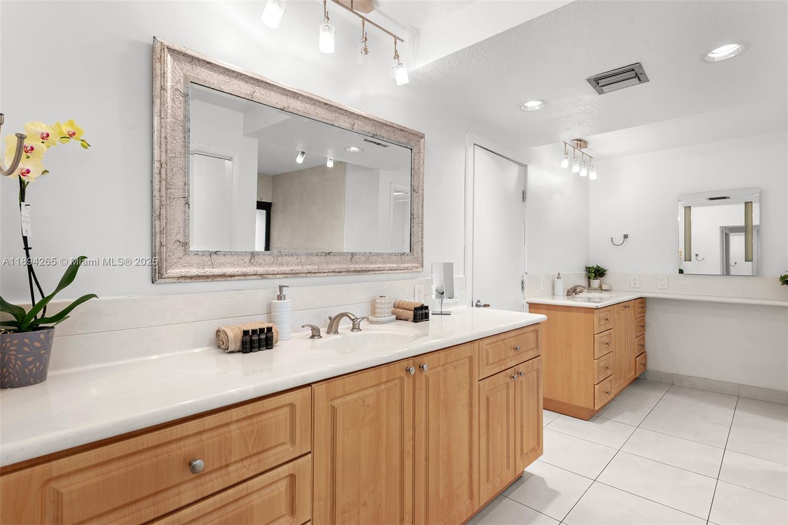 207 Holiday Drive Hallandale Beach, FL 33009 - Photo 37 of 50 a bathroom with a sink and a mirror