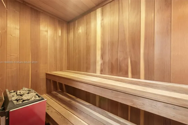 a bedroom with 2 bed and a window