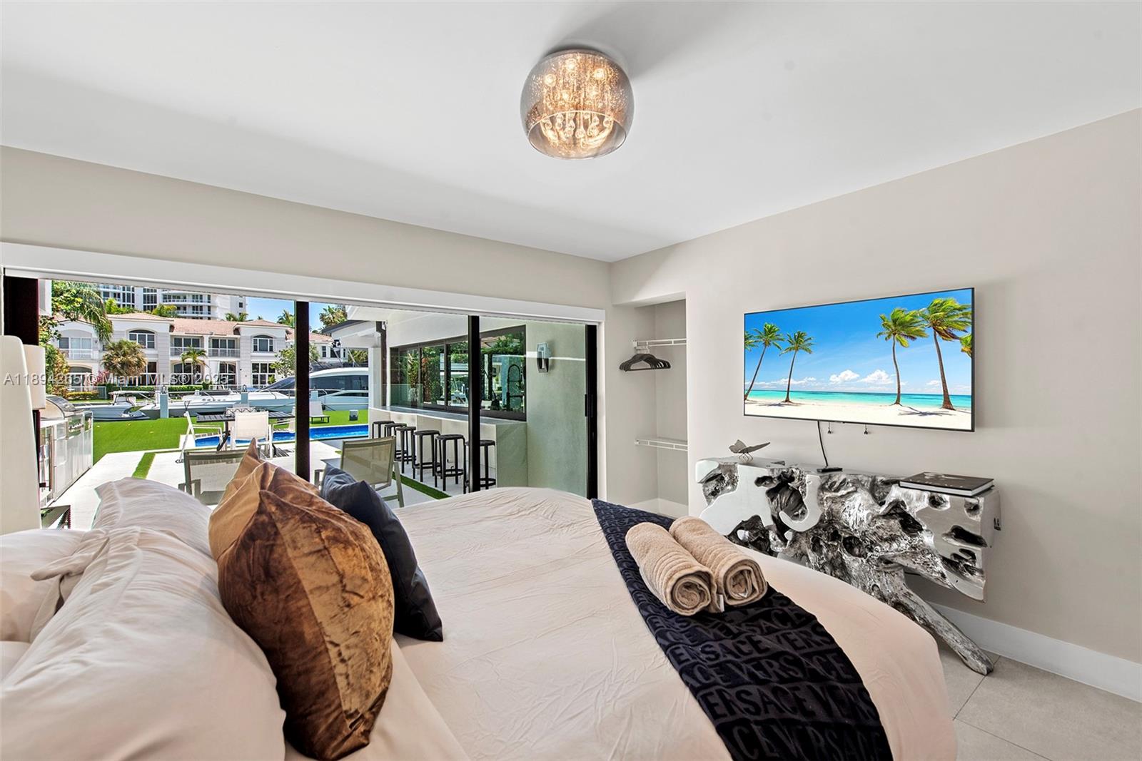 207 Holiday Drive Hallandale Beach, FL 33009 - Photo 40 of 50 a bedroom with a bed and a large window